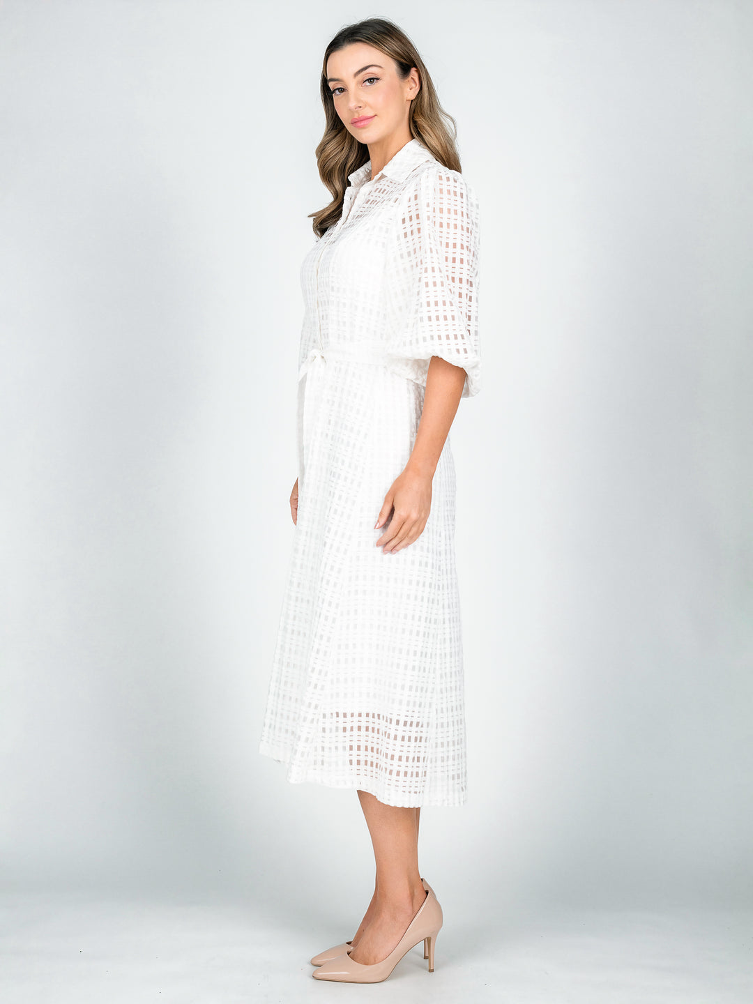 Side Women's sheer white shirt dress with blouson 3/4 length sleeves and a-line midi length skirt