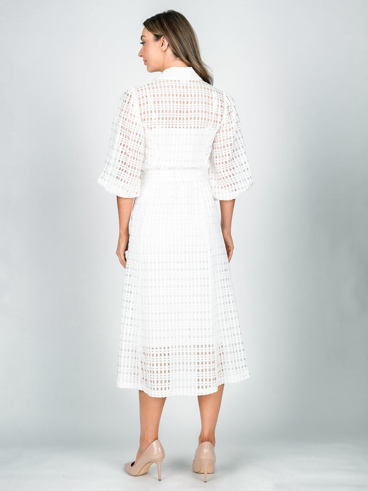 Back of women's sheer white shirt dress with blouson 3/4 length sleeves and a-line midi length skirt